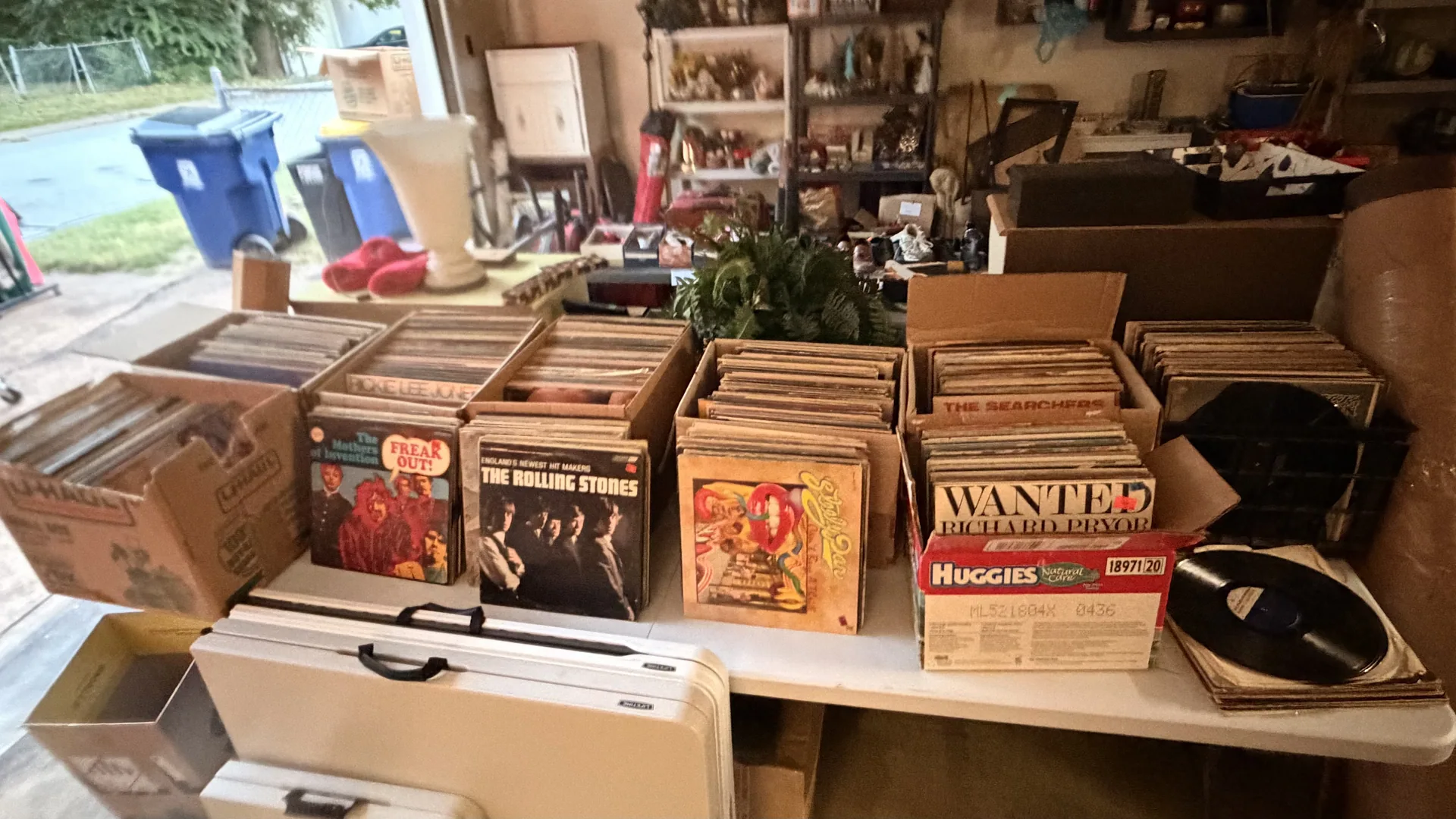 Garage vinyl record boxes rolling stones at an estate sale Lake St. Louis