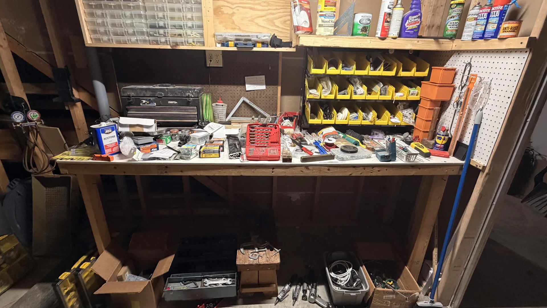 Garage workbench hand tools yellow parts bins at an estate sale O'Fallon
